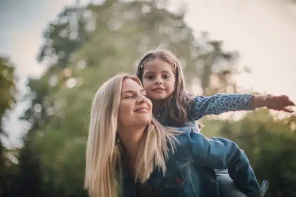 happy mum and daughter following mediation to resolve parental alienation Manchester
